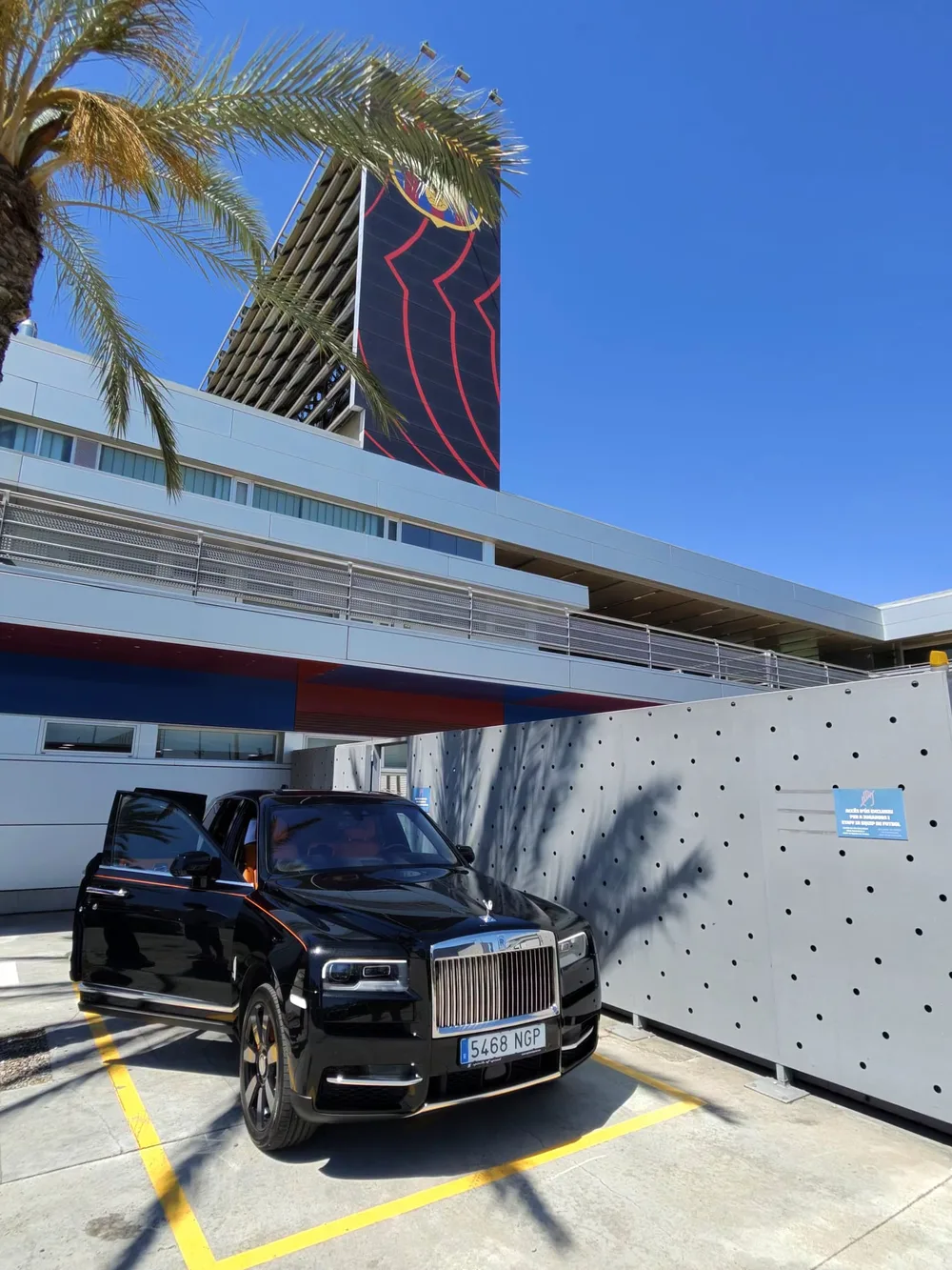 Black Rolls-Royce Cullinan parked outside FC Barcelona training facilities