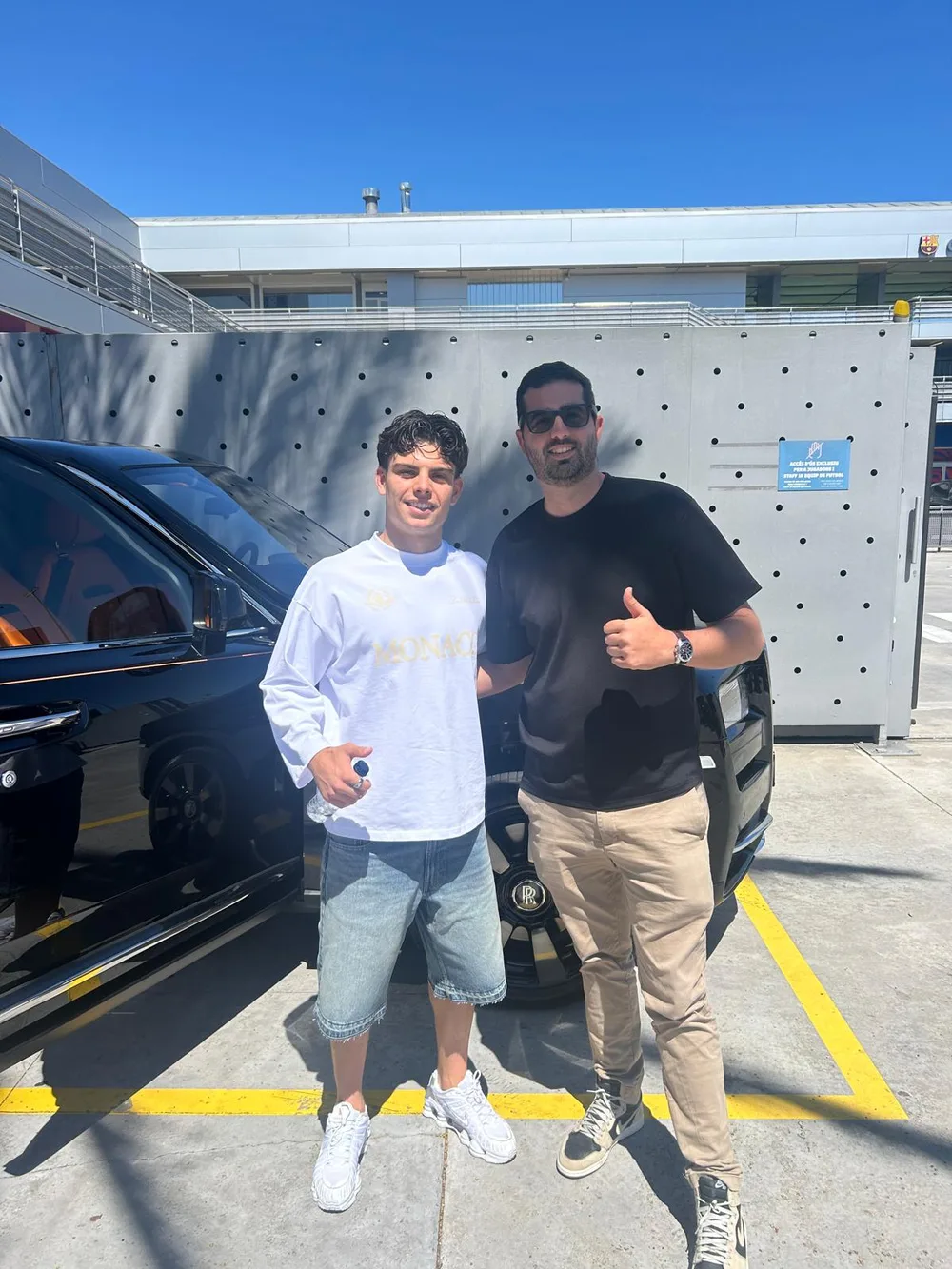 Xavi Espart, FC Barcelona defender, with Ultra Lux’s CEO and a black Rolls-Royce Cullinan in the background